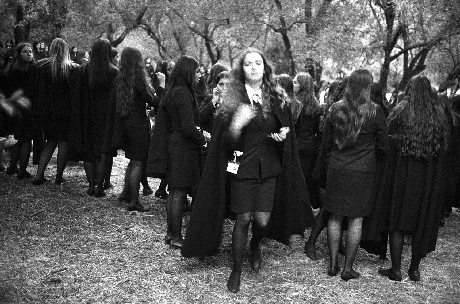 Students wearing academic capes gather during Praxe in Portugal